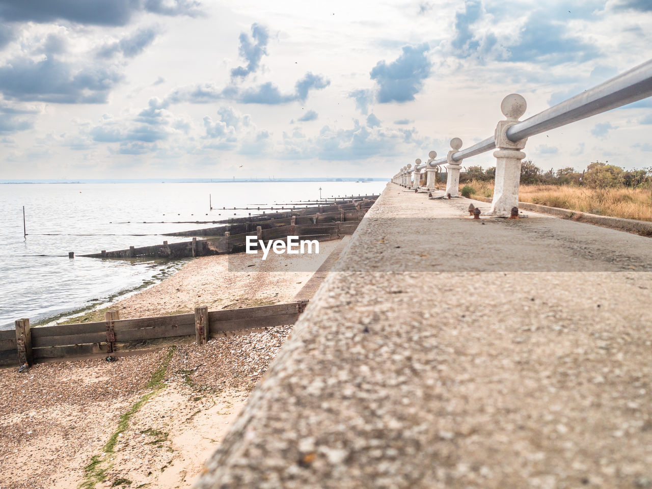 Low angle view along promenade and beach at shoeburyness seafront