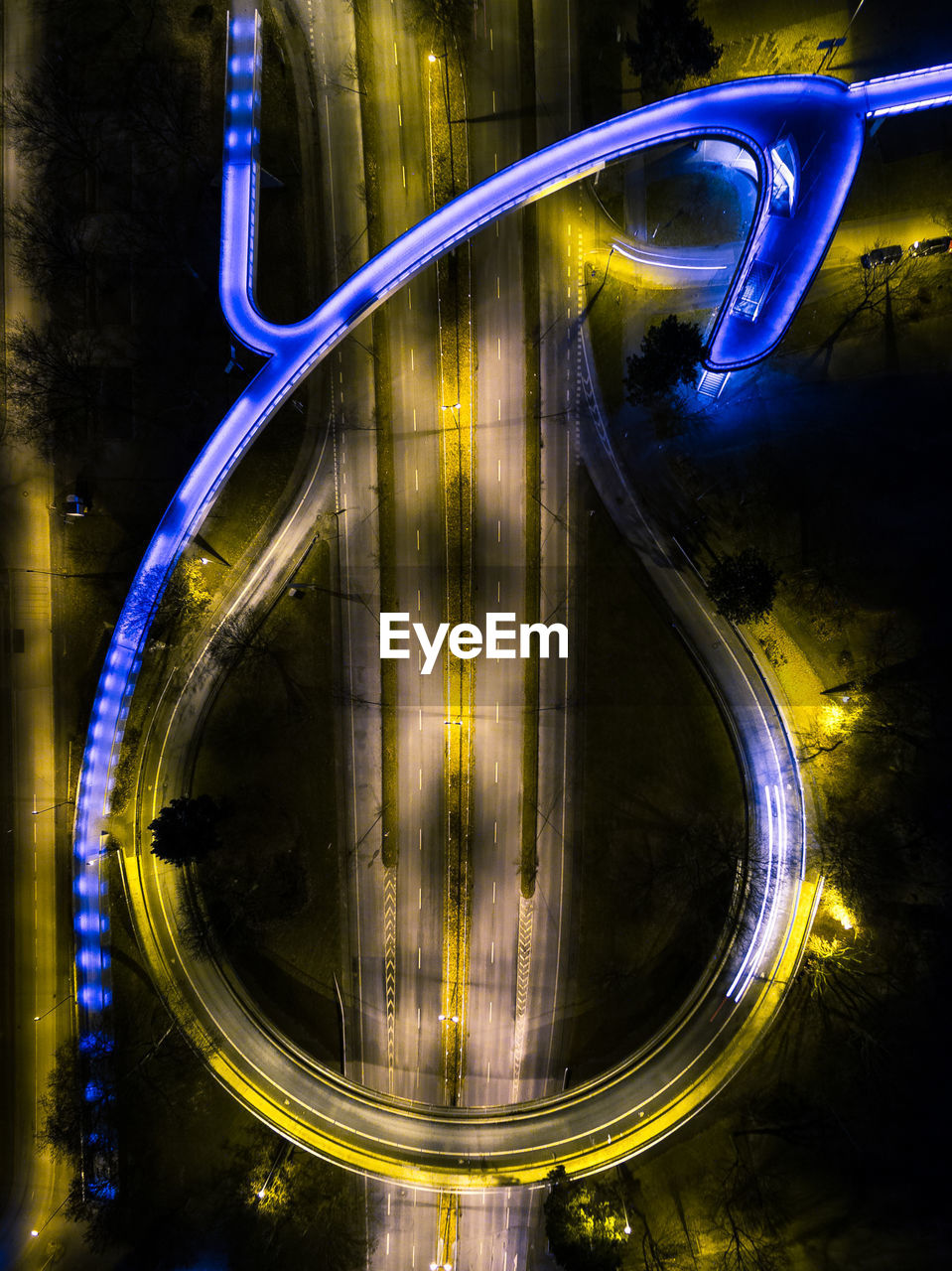High angle view of light trails on road at night