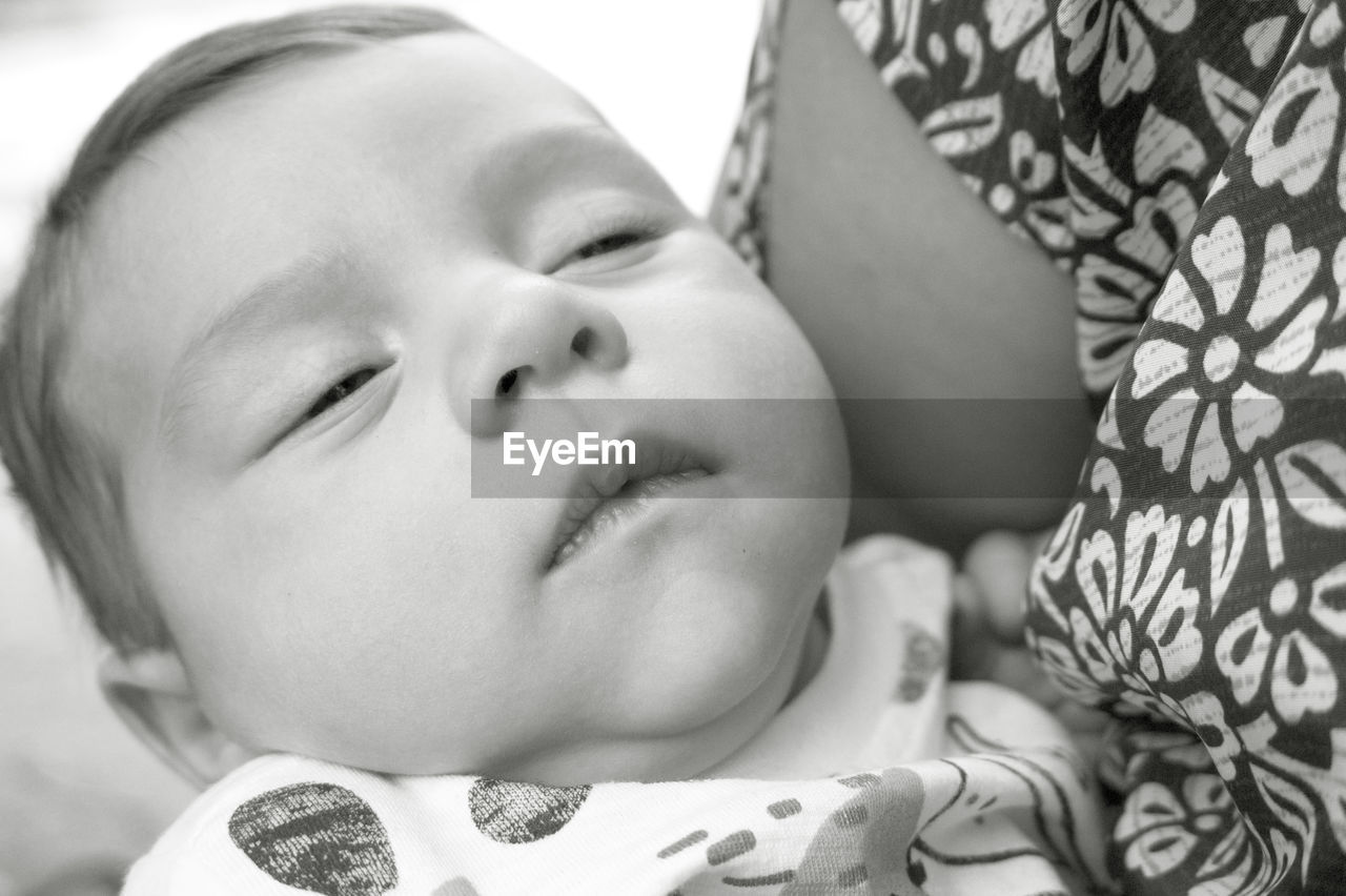 person, child, childhood, black and white, baby, portrait, monochrome photography, indoors, lying down, headshot, cute, portrait photography, relaxation, innocence, monochrome, emotion, eyes closed, one person, adult, close-up, toddler, furniture, human face, babyhood, lifestyles, bed, women, positive emotion, bedtime, beginnings, sleeping, female, family, love, newborn, parent, happiness, home interior, smiling