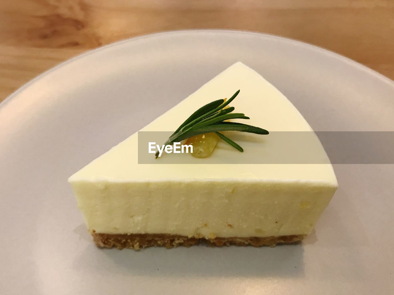Close-up of lemon cheesecake in plate on table