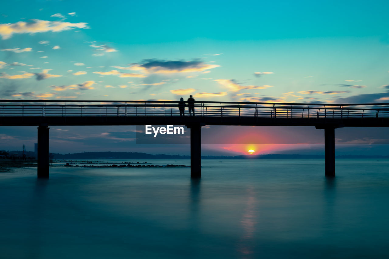 bridge over sea against sky