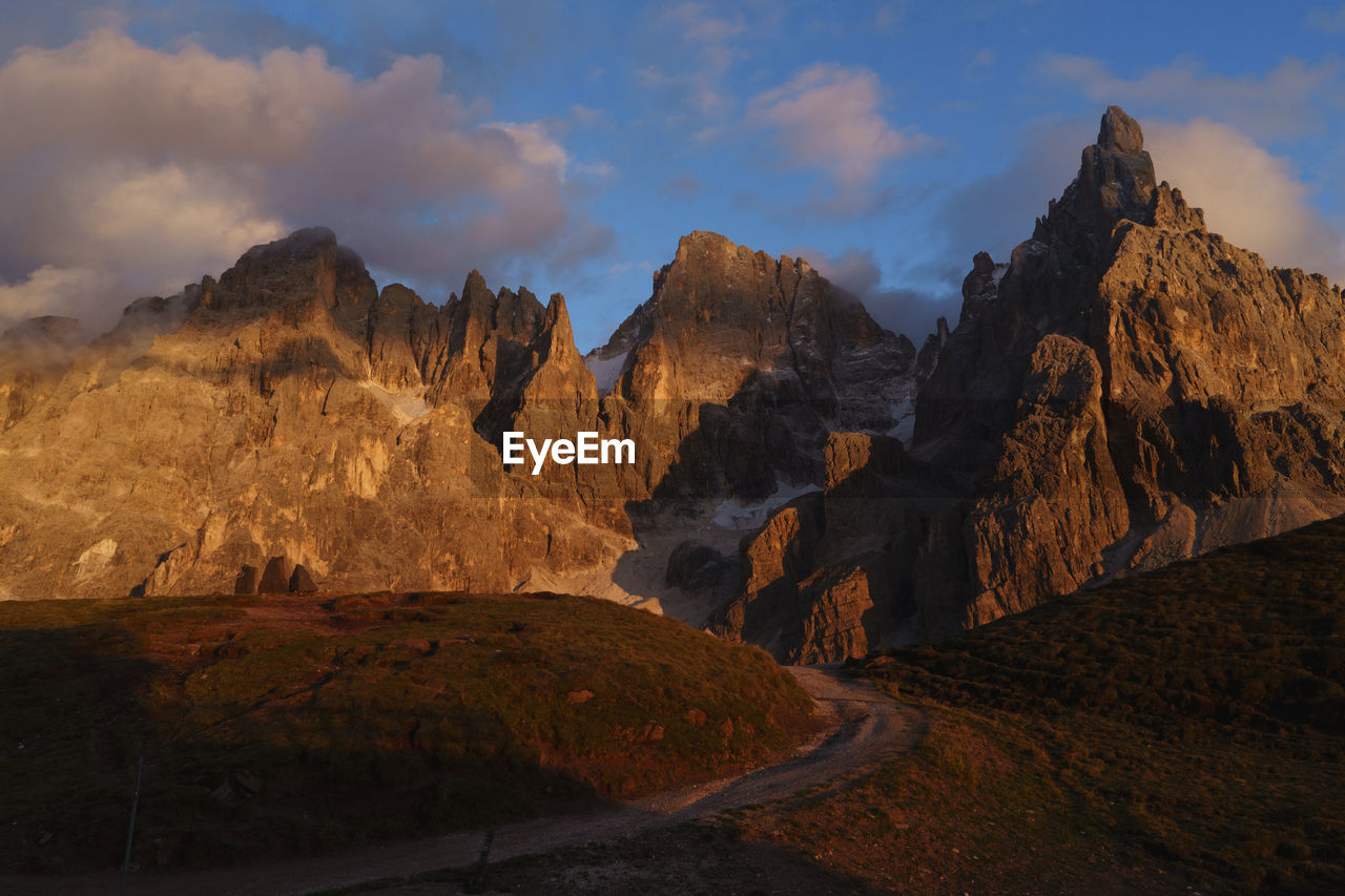 Scenic view of mountains against cloudy sky