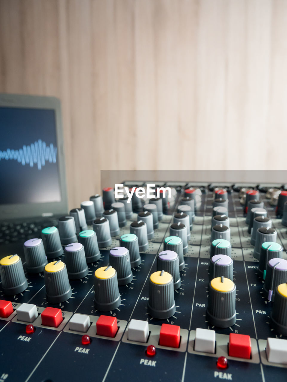 Close-up of sound mixer against wall