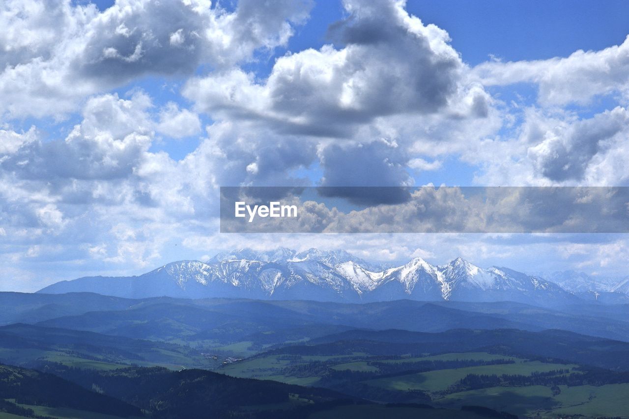 Scenic view of snowcapped mountains against sky