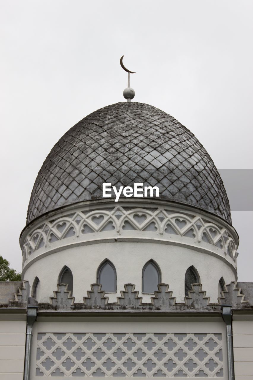 Low angle view of mosque against clear sky