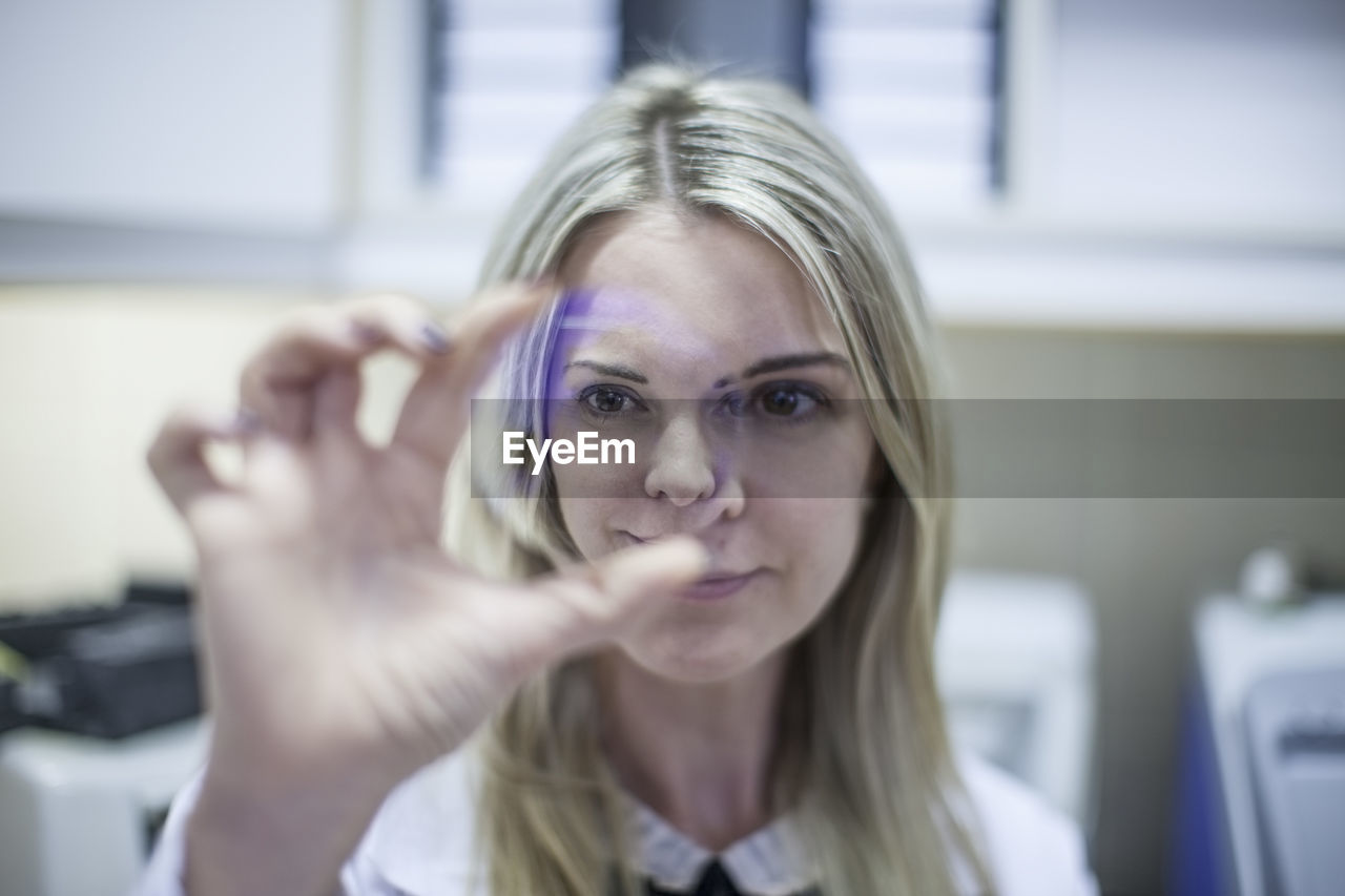 Optometrist looking through eydeglass lens