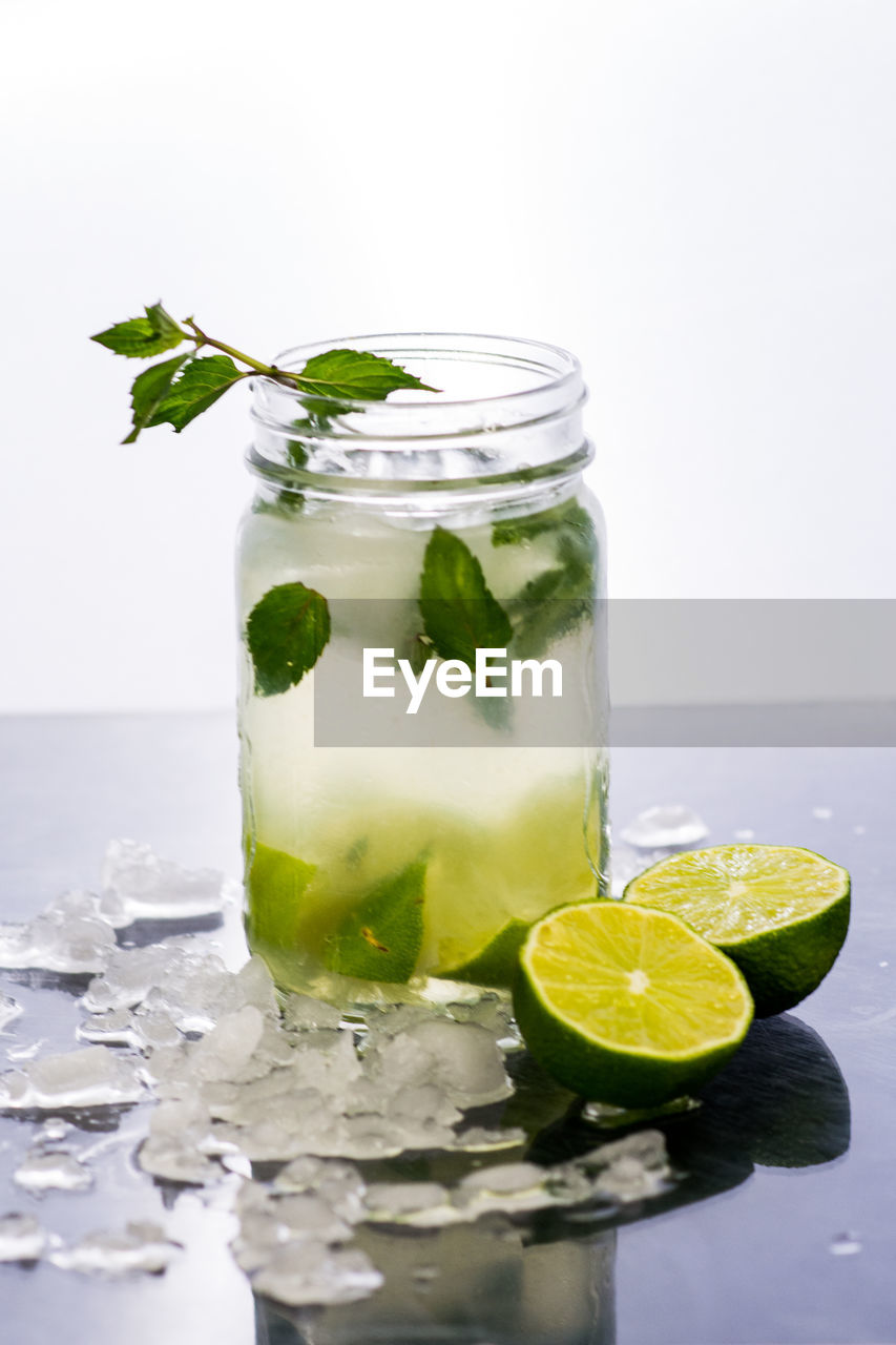 FRUITS IN GLASS CONTAINER WITH DRINK