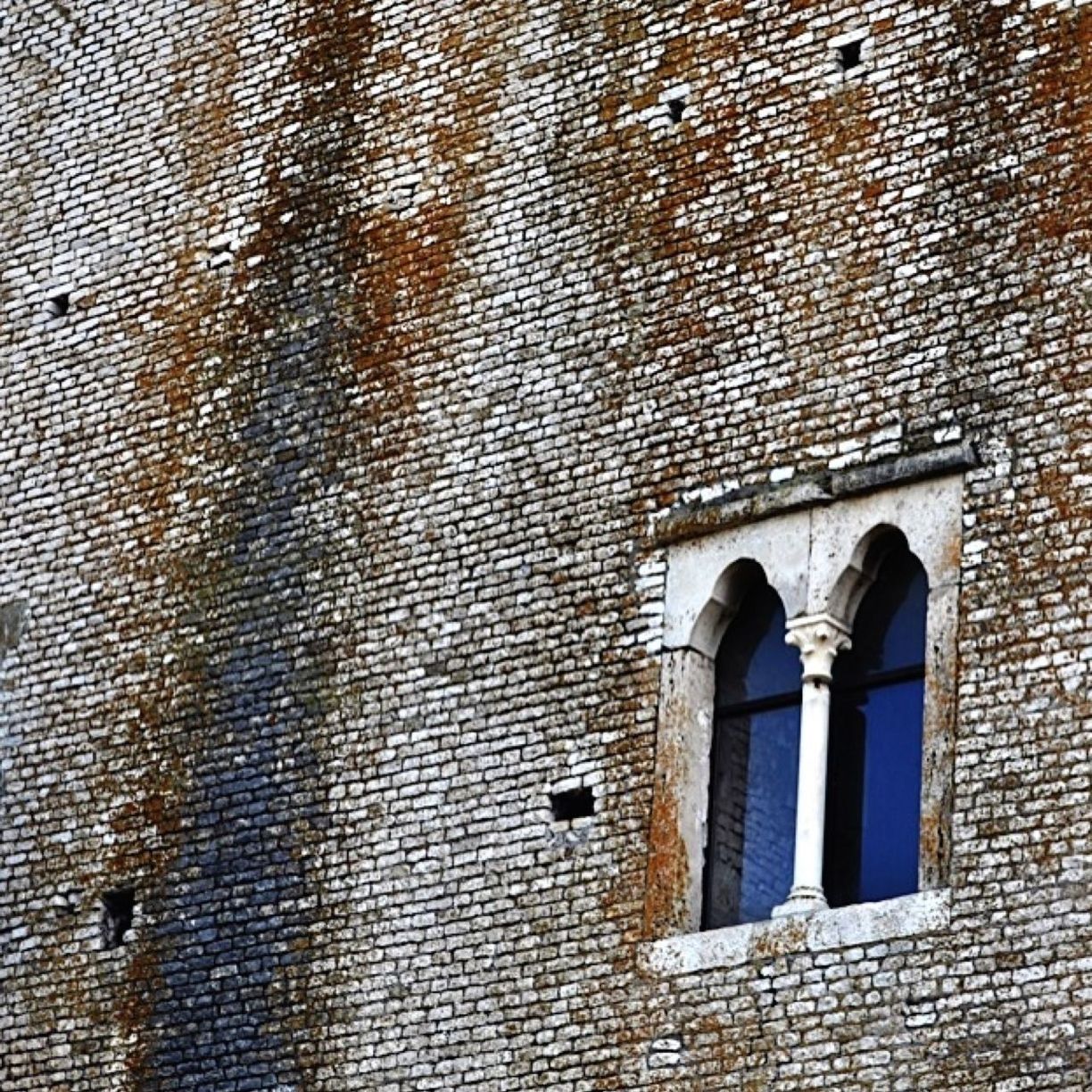 View of window in brick wall