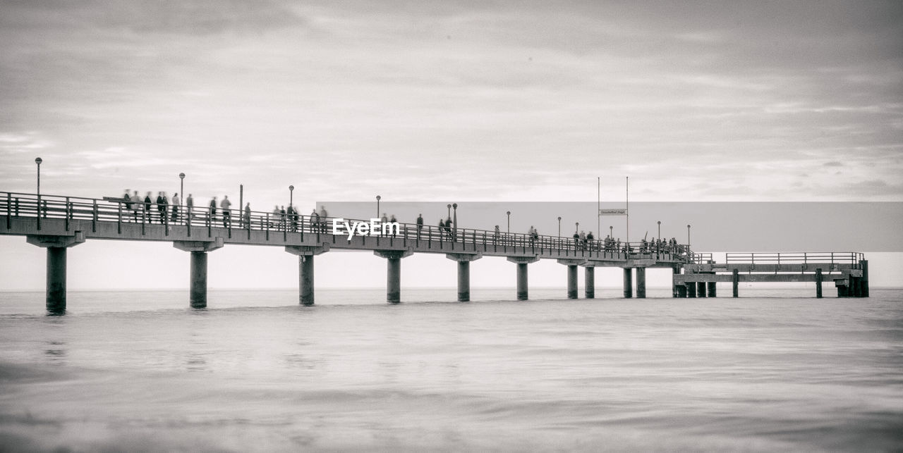 Pier over sea against sky