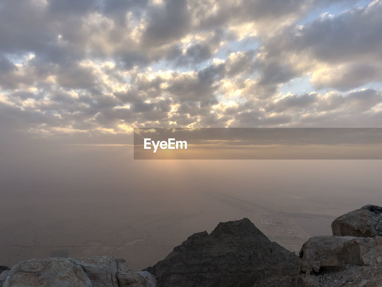 Scenic view of rock formation against sky during sunset