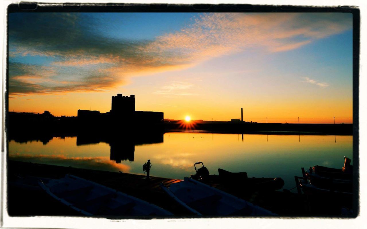 SILHOUETTE OF BUILDINGS AT SUNSET