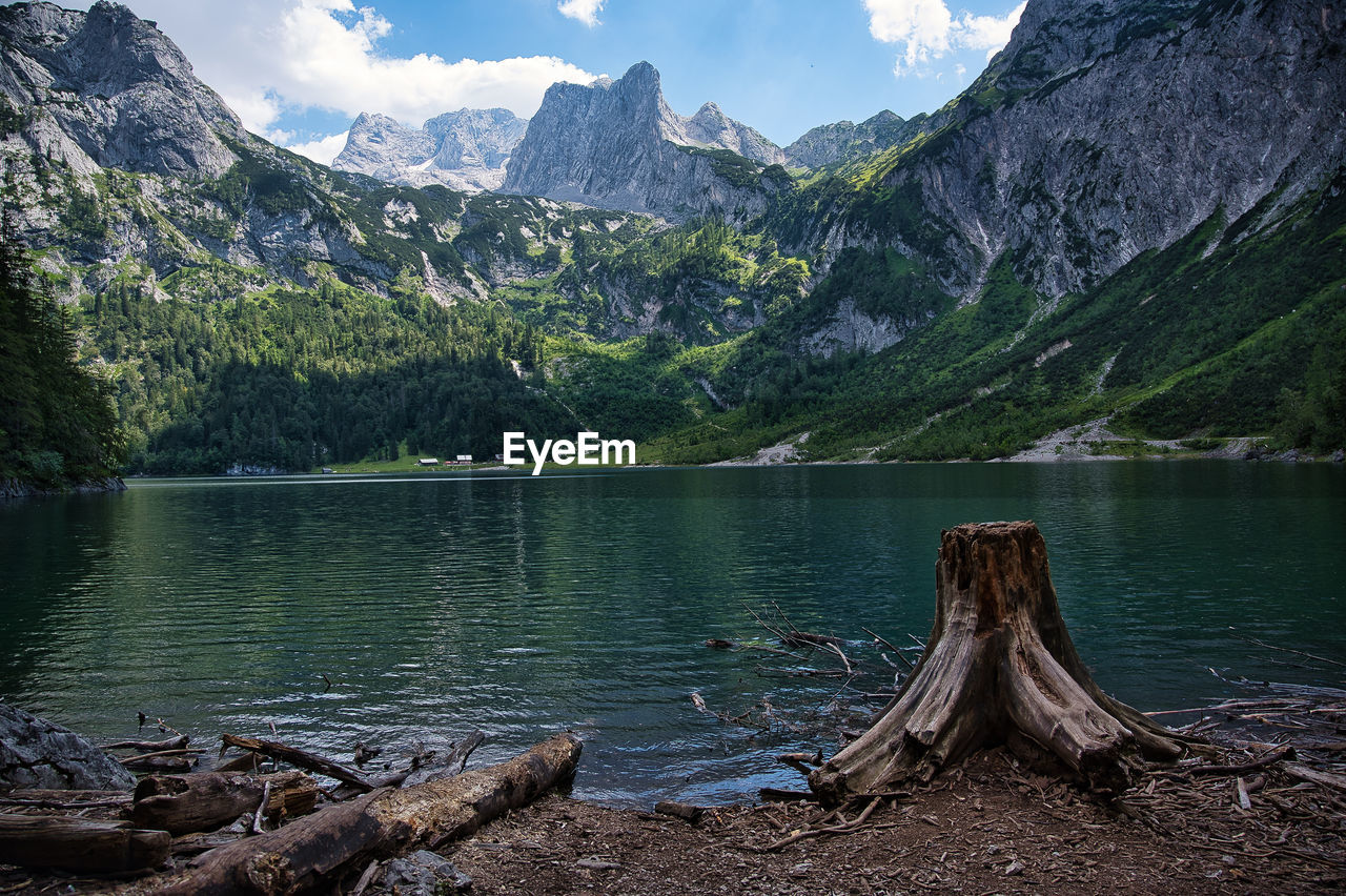 Scenic view of lake and mountains against sky