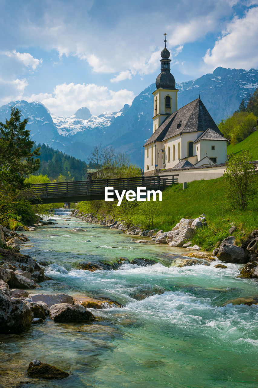 Church and river in the village ramsau in spring