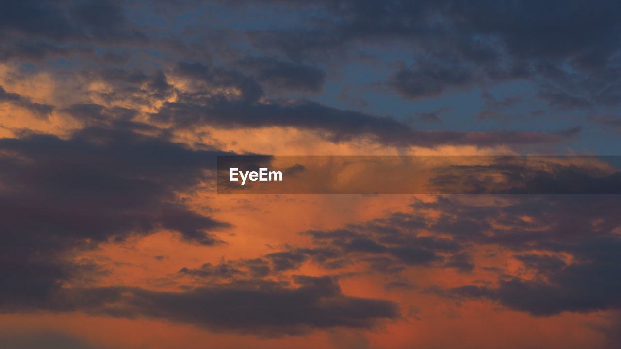 Low angle view of dramatic sky during sunset