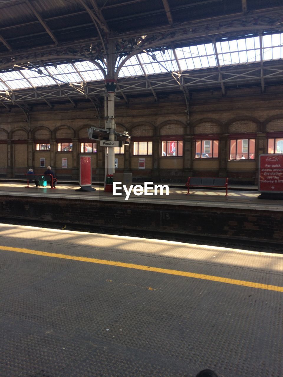 TRAIN ON RAILROAD STATION PLATFORM