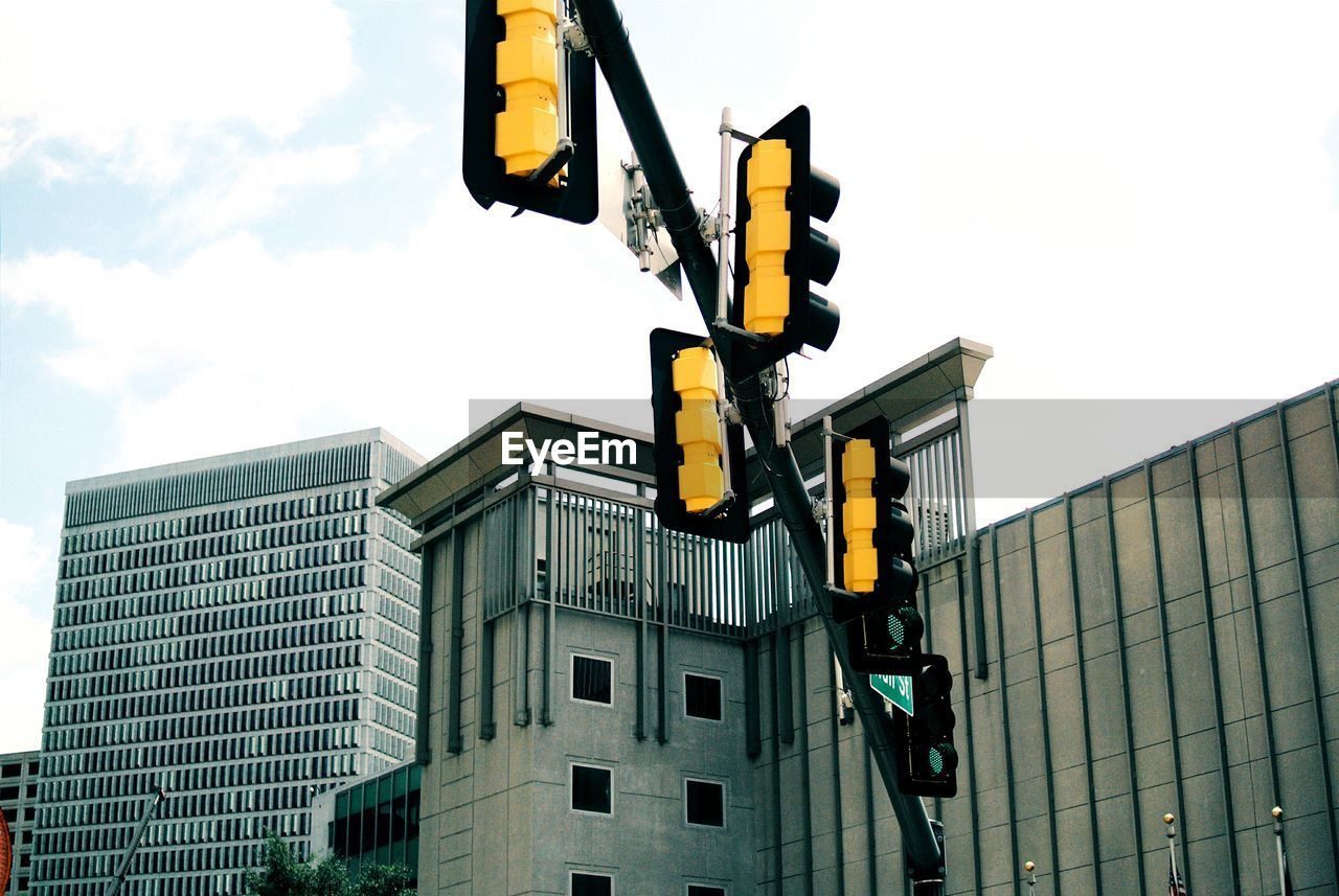 Low angle view of road signal in city