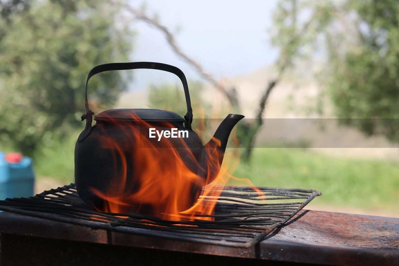 Close-up of burning tea kettle