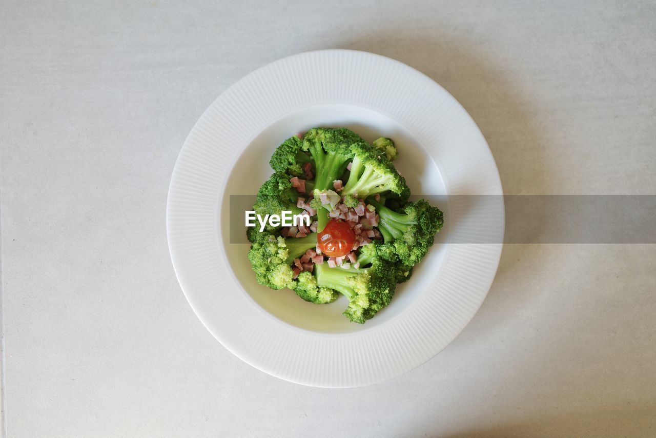 Directly above shot of fried broccoli in plate on table