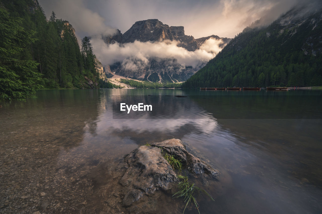 Scenic view of lake and mountains against sky