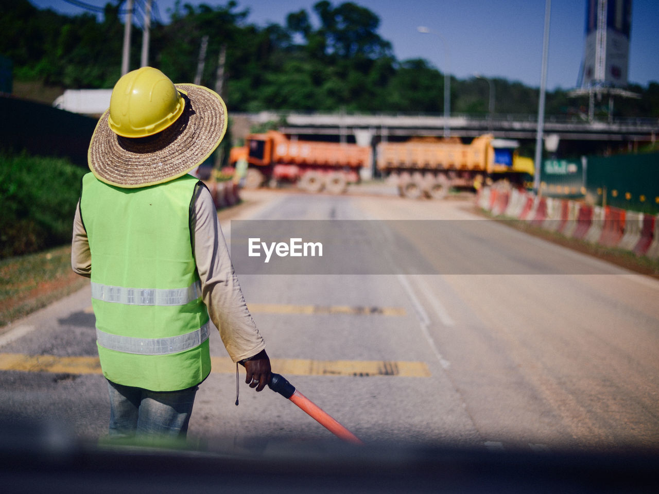 rear view of man standing on road