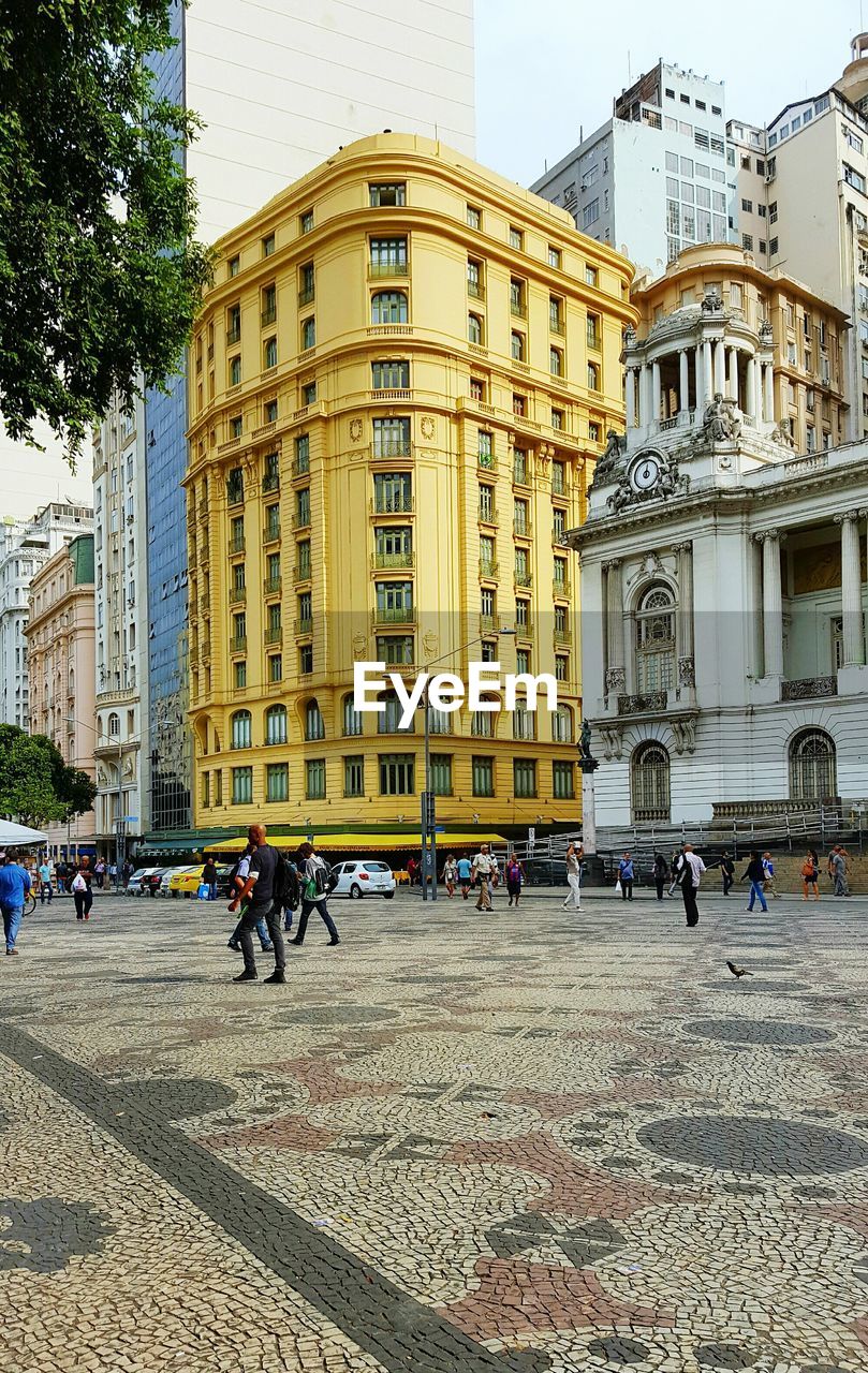 People walking on street in city