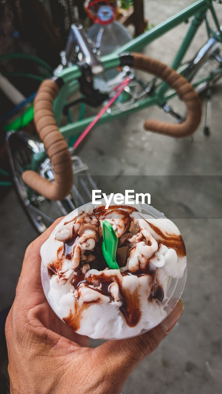 Cropped hand of person holding ice cream