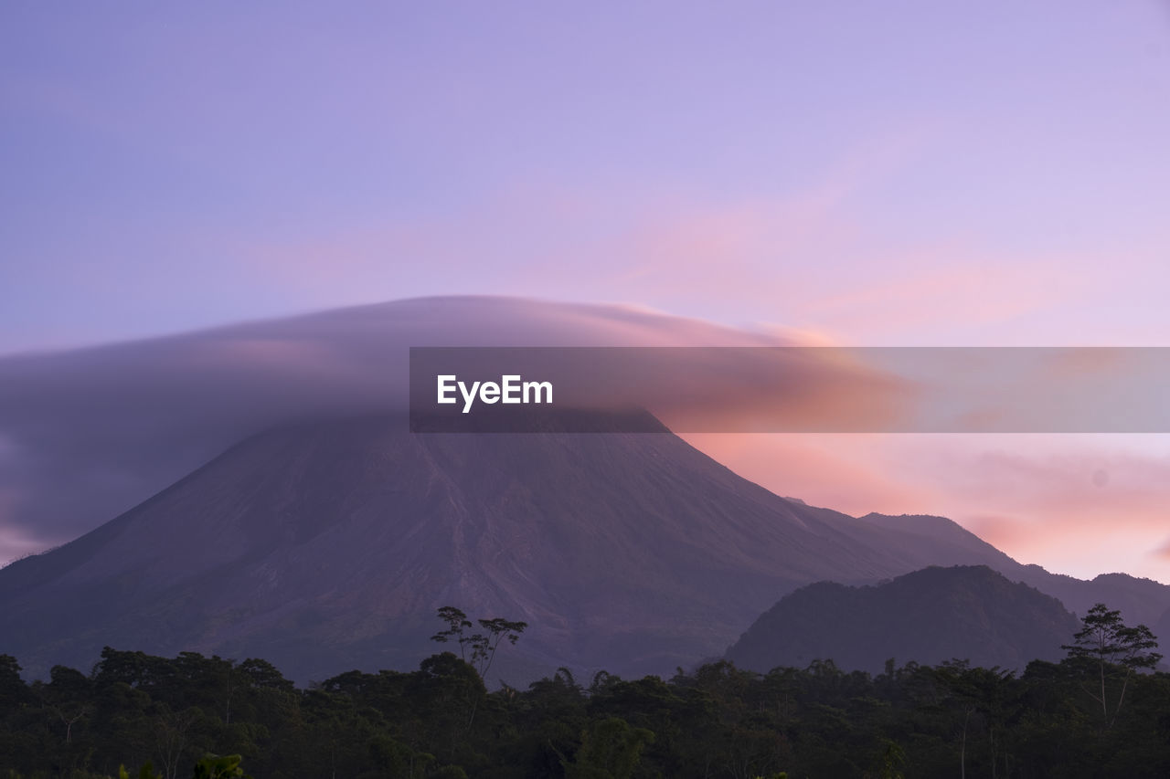 Scenic view of mountains against sky during sunset