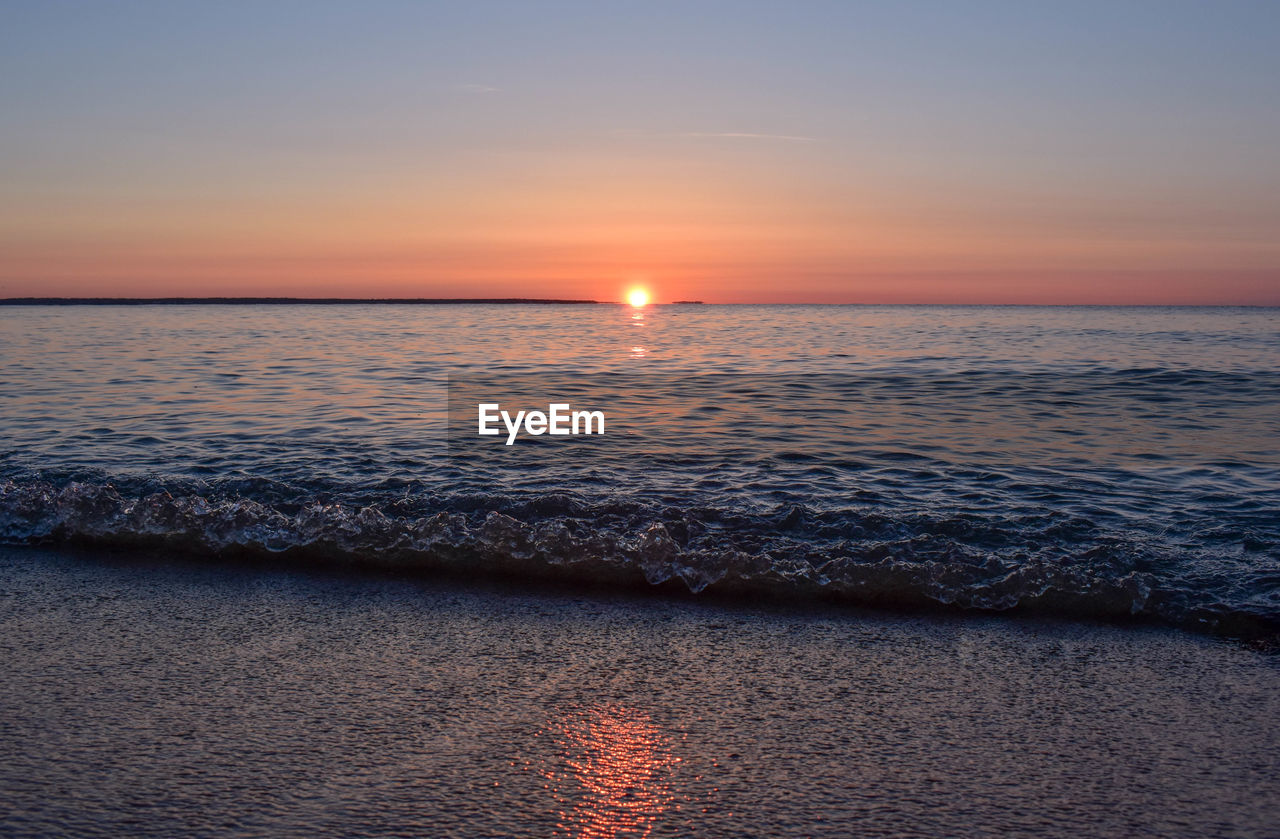 Scenic view of sea against sky during sunset