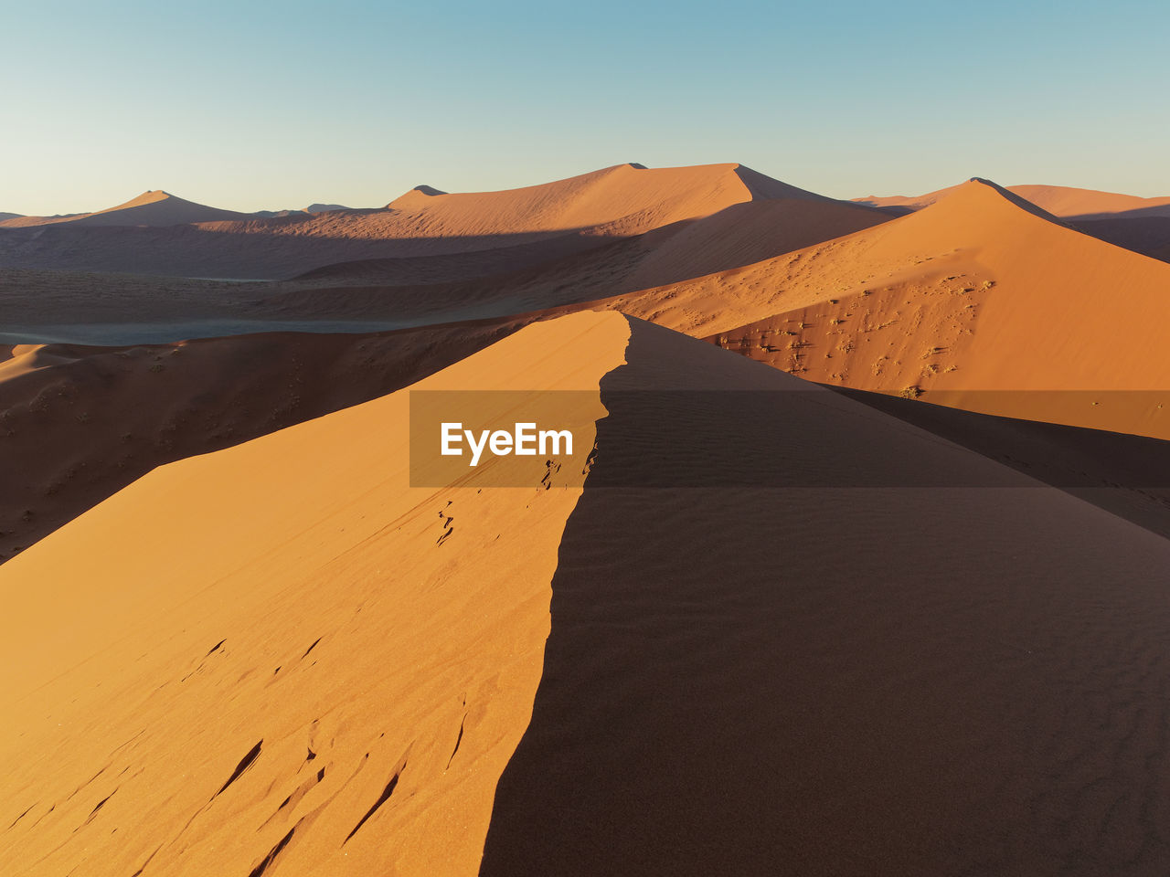 Scenic view of desert against clear sky