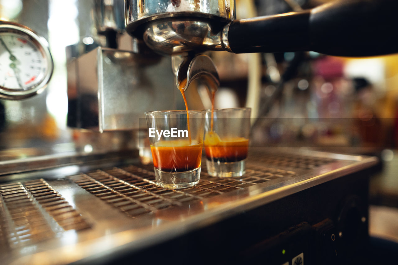 close-up of coffee pouring in glass