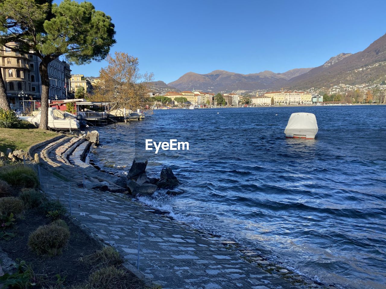 SCENIC VIEW OF RIVER BY MOUNTAIN AGAINST CLEAR SKY