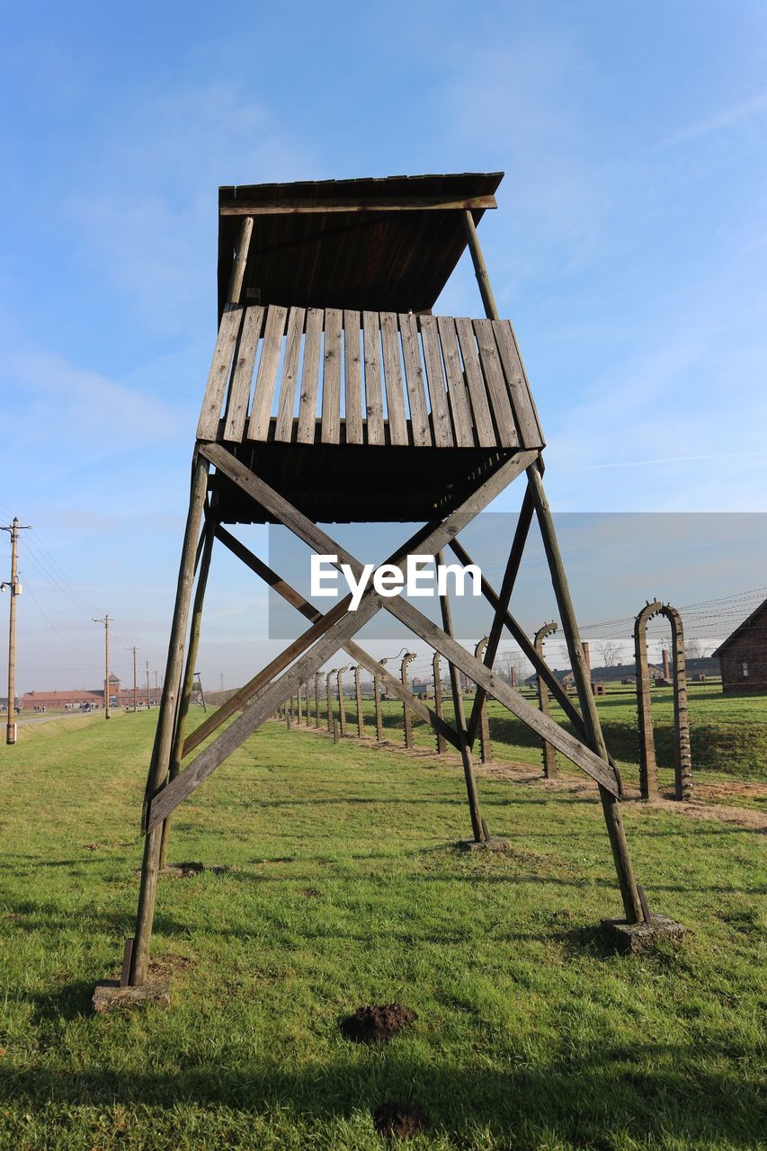 GAZEBO ON FIELD AGAINST SKY