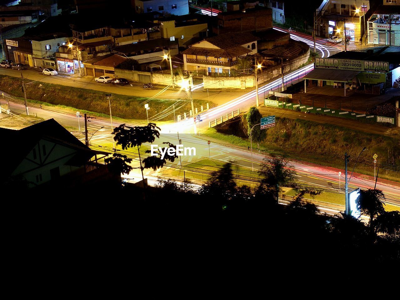 ILLUMINATED BUILDINGS IN CITY AT NIGHT