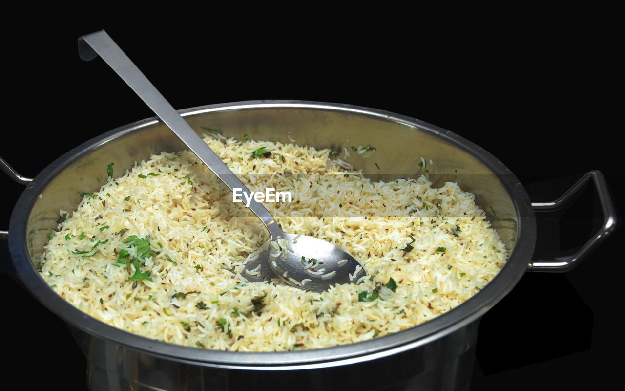 HIGH ANGLE VIEW OF FOOD IN BOWL ON BLACK BACKGROUND