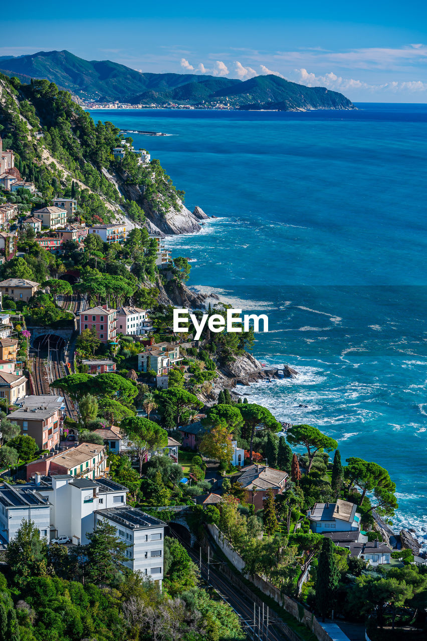 high angle view of townscape by sea