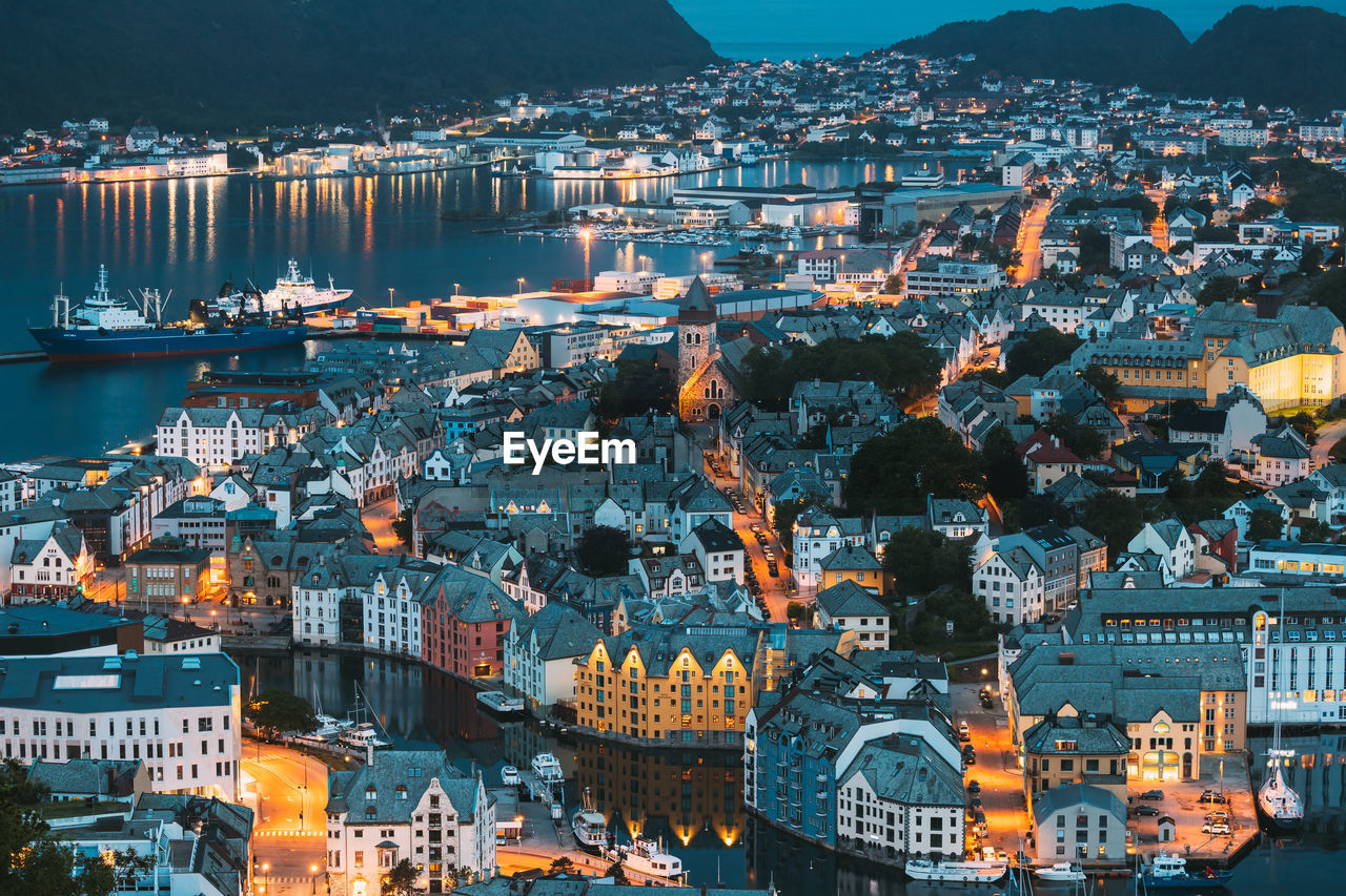 high angle view of illuminated city lit up at night