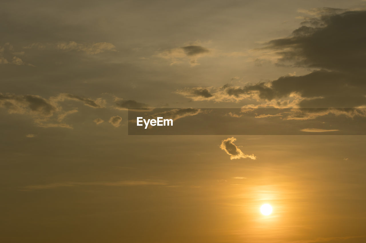 LOW ANGLE VIEW OF SILHOUETTE SUN DURING SUNSET