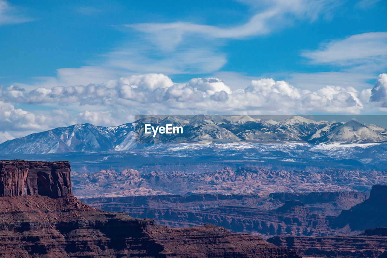 scenic view of mountains against blue sky