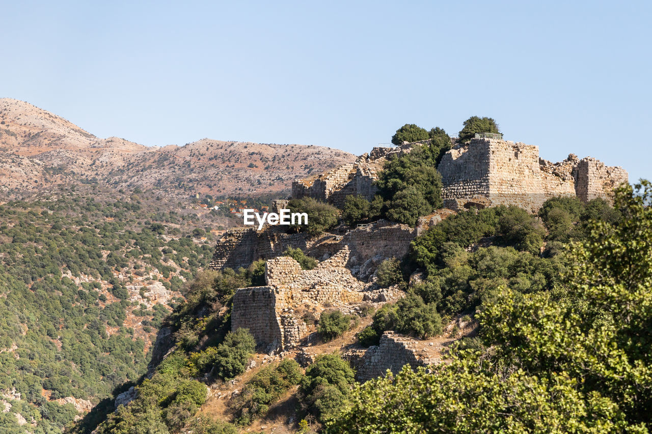 VIEW OF FORT AGAINST MOUNTAIN