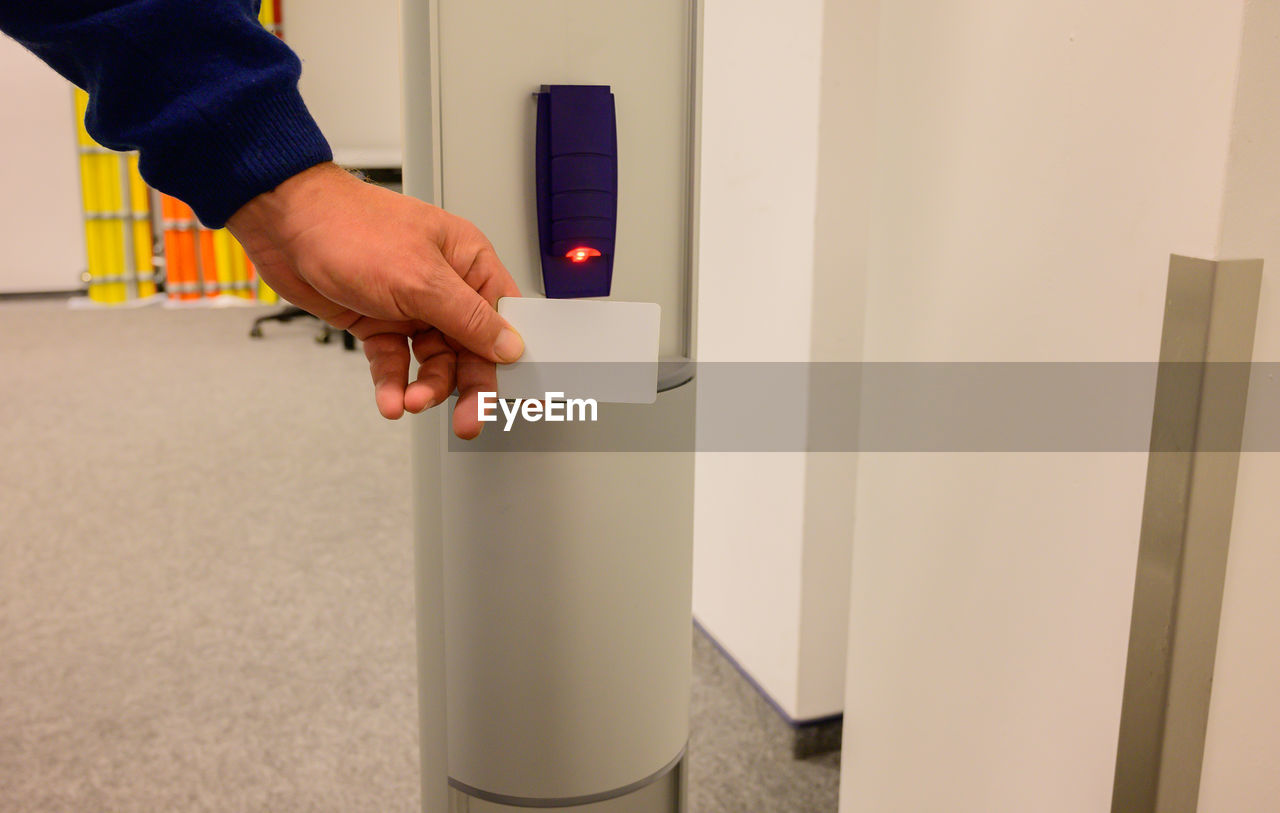 hand, one person, adult, arm, men, indoors, technology, business, clothing, entrance, person, door, floor