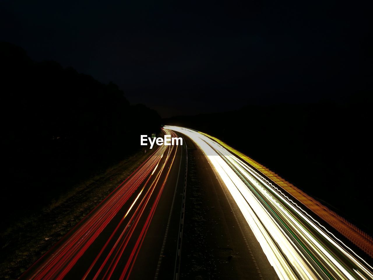 Light trails on road at night