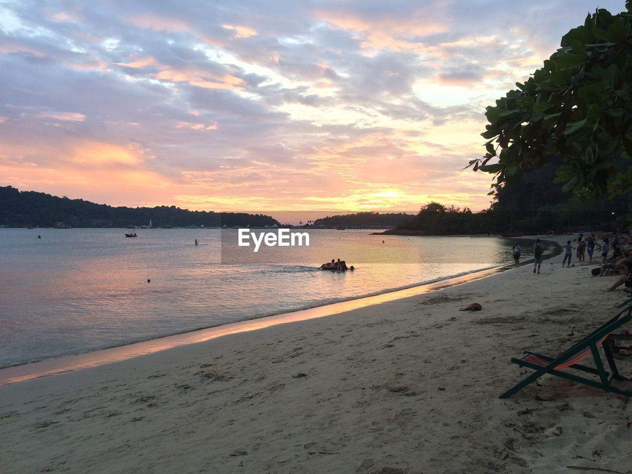 SCENIC VIEW OF BEACH DURING SUNSET