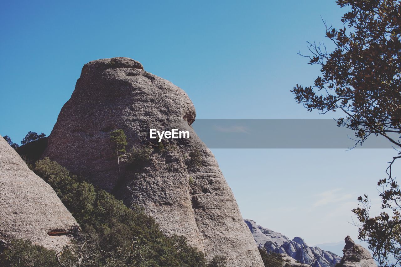 LOW ANGLE VIEW OF ROCK FORMATION