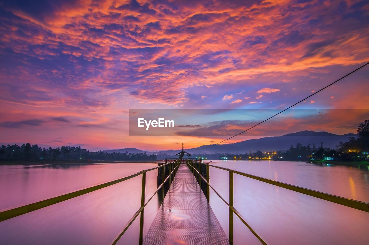 Scenic view of bridge against sky during sunset