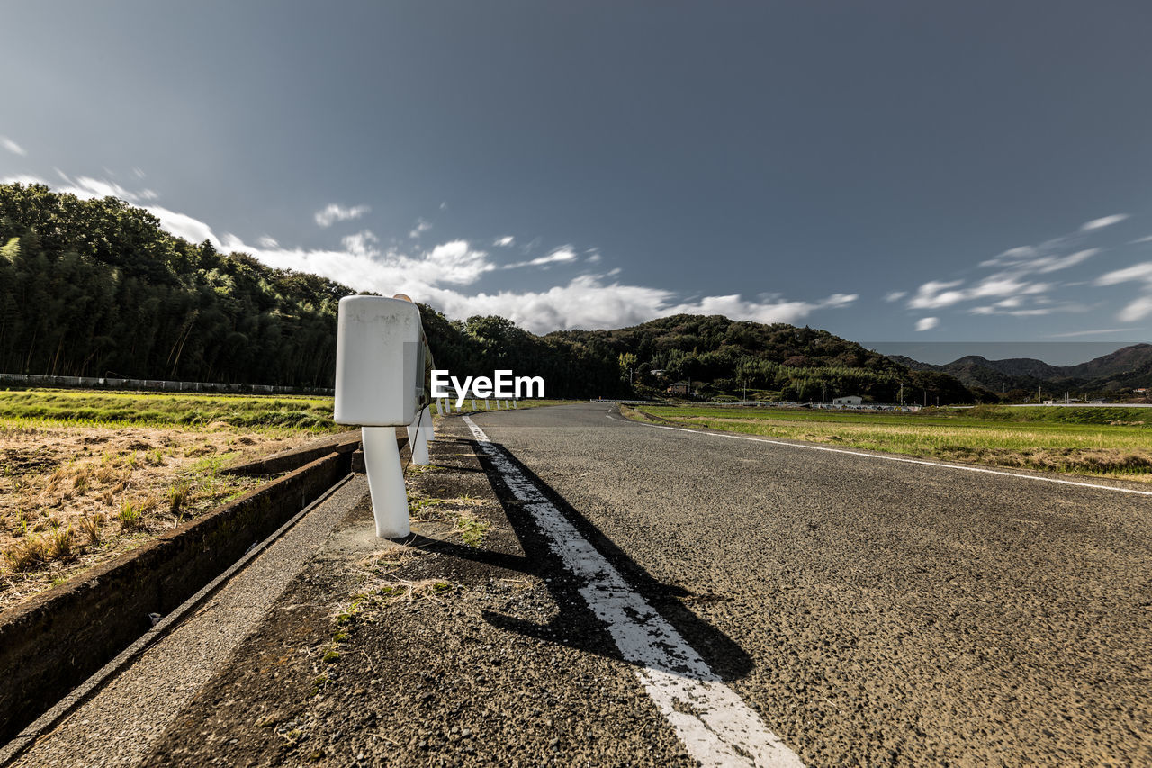 Empty road against sky