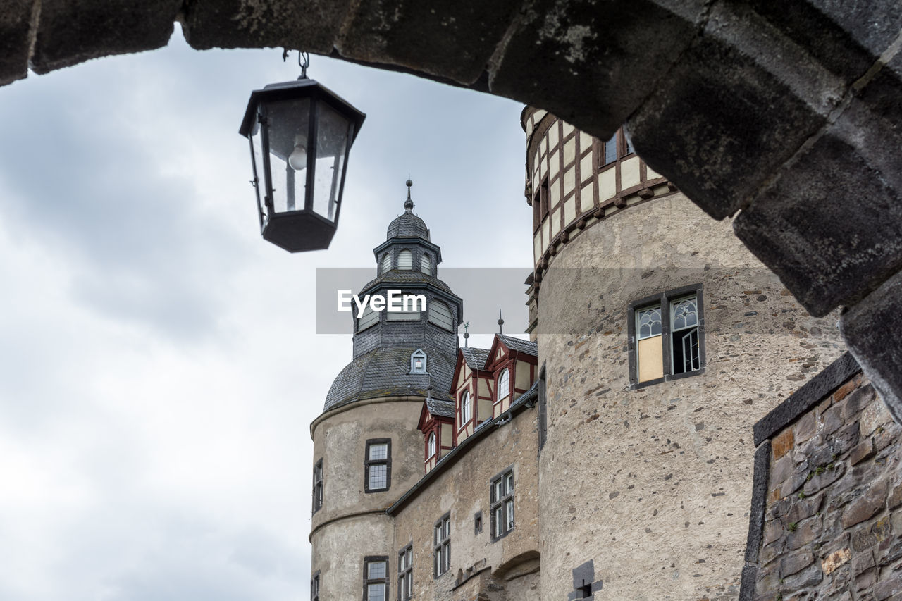 Low angle view of schloss burresheim castle against sky