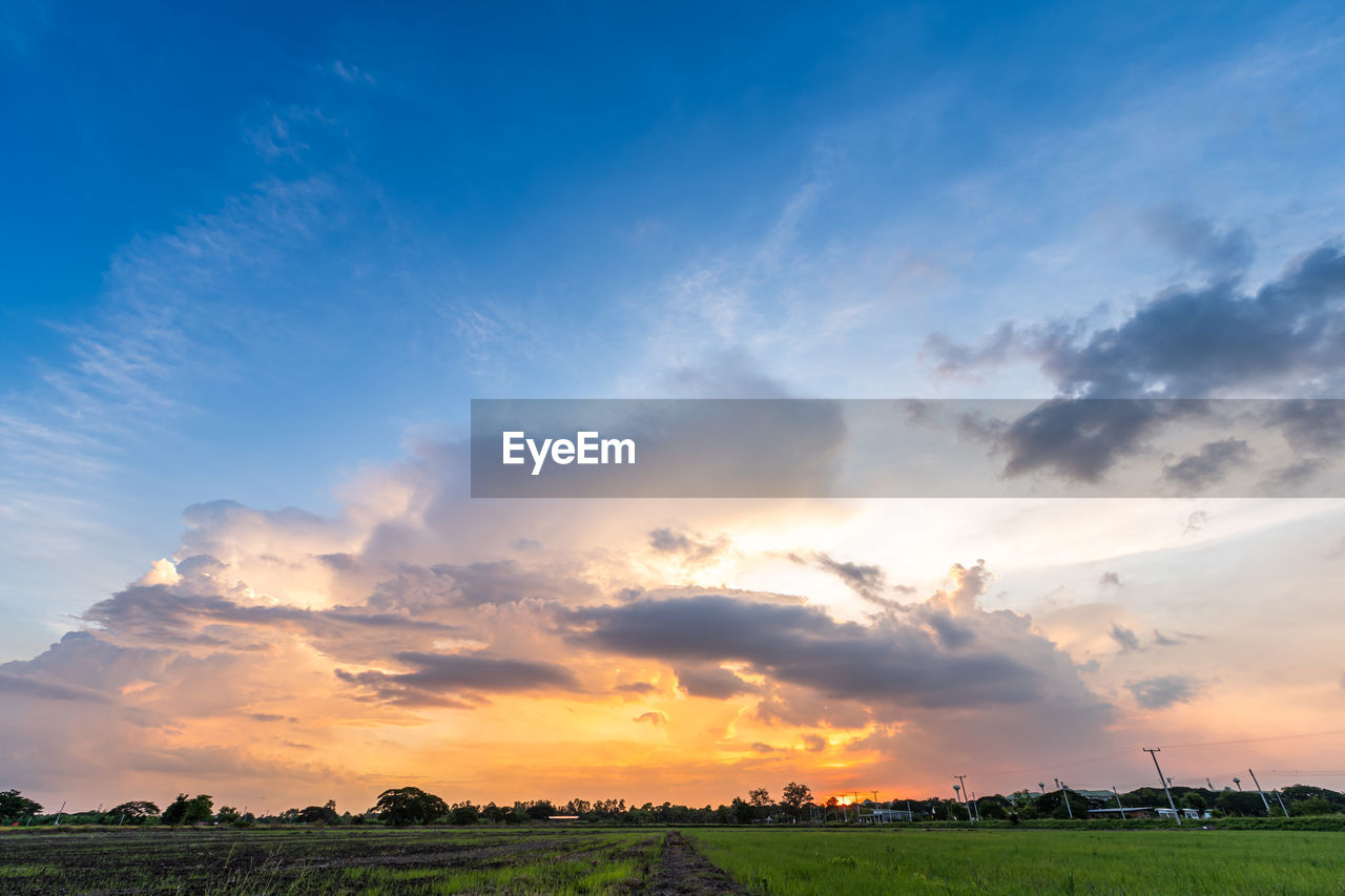 SCENIC VIEW OF SUNSET OVER LAND