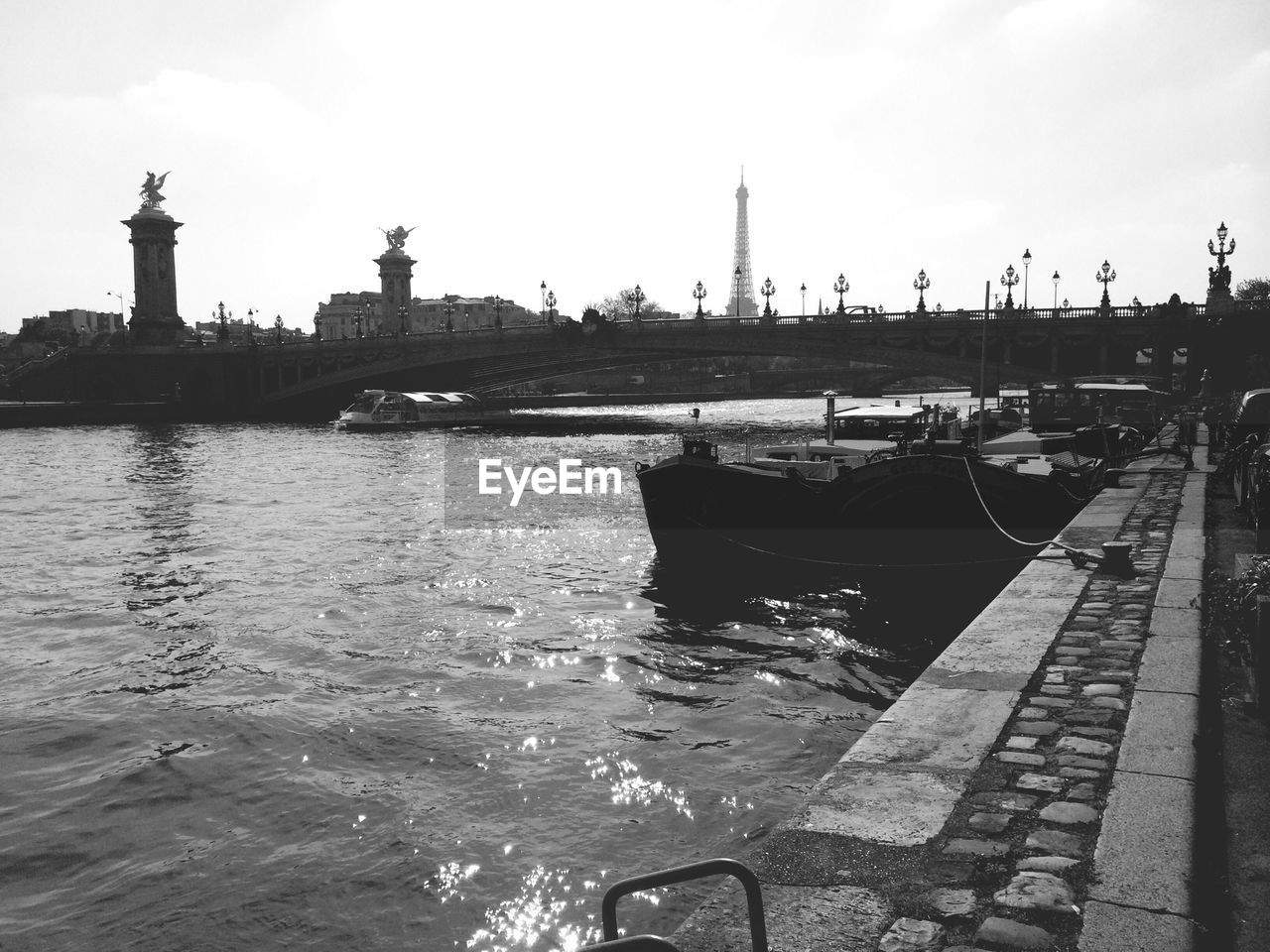 View of river and eiffel tower in background
