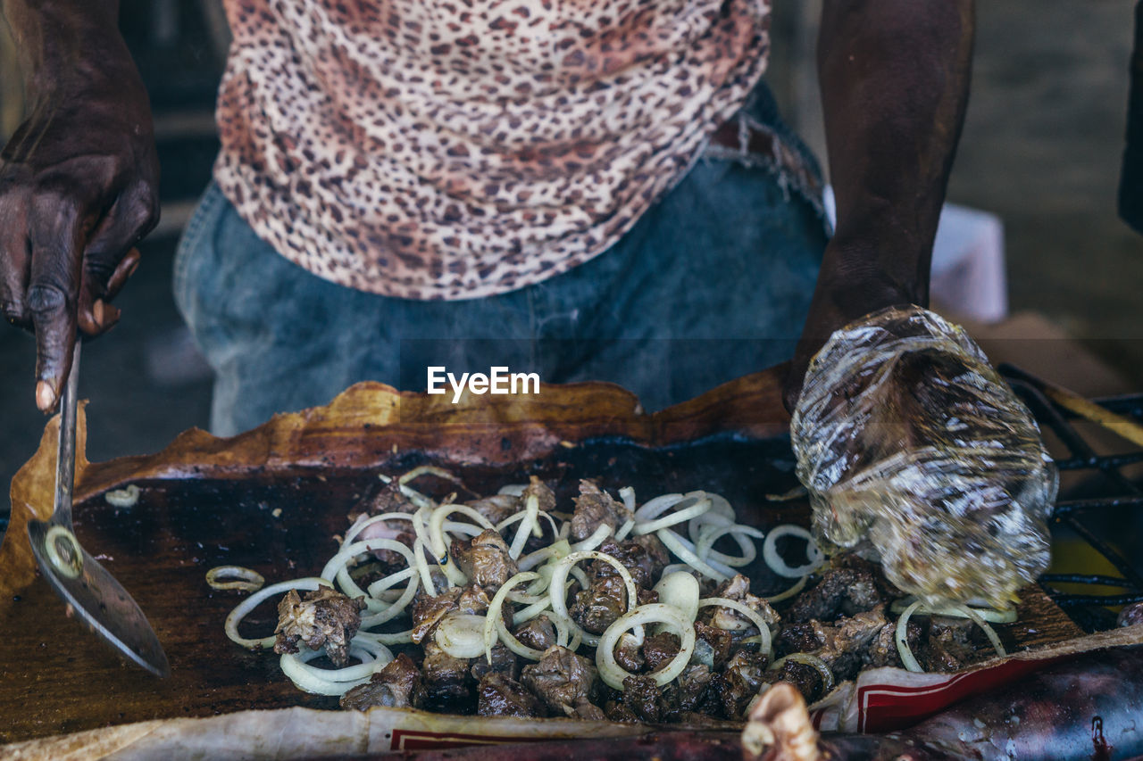 Close-up of man preparing food