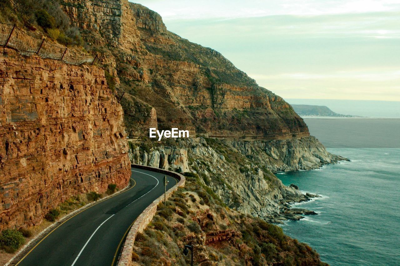 Panoramic view of road by sea against sky